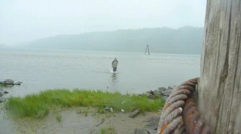 Man Walks Back from River Stock Footage 874986