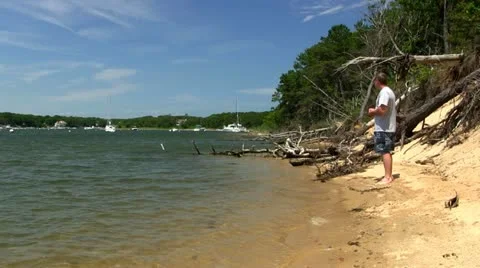 Man walks beach; 2 Stock Footage 12202523