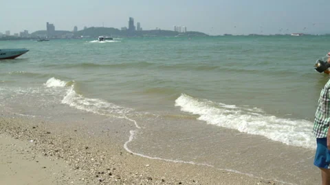 Man walks on the beach Stock Footage 91626317