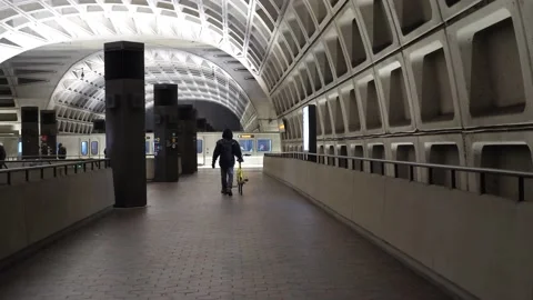 Man walks with Bicycle through Metro Station Stock Footage