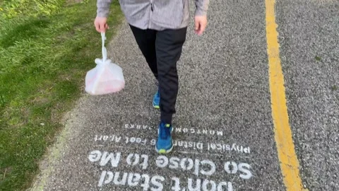 A man walks on the Capital Crescent Trail during COVID-19 Stock Footage 130603853