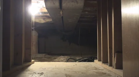 Man walks into crawl space Video stock 53981885