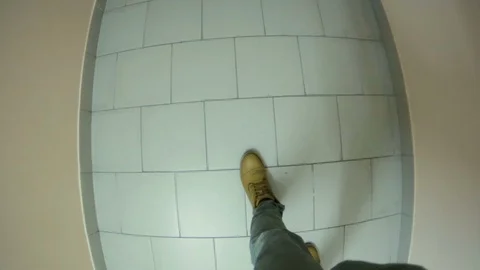 A man walks down the hall and goes to the elevator Stock Footage 105370635