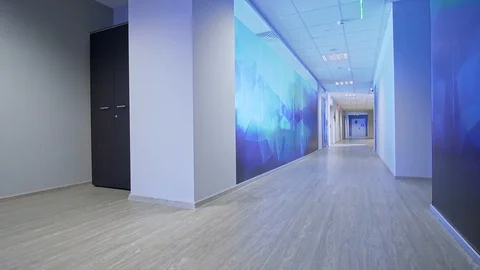 A man walks down the hall Stockbeeldmateriaal 130034615