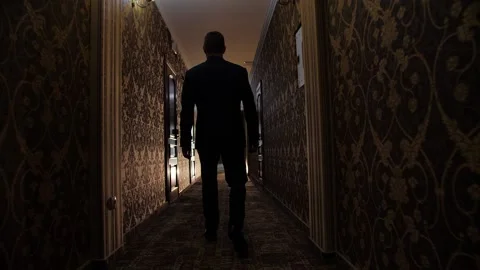 The man walks down the hall Stock Footage 172139147
