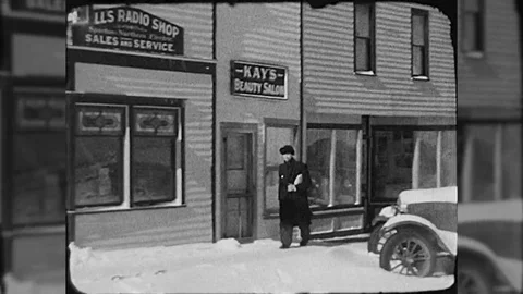 Man Walks Down Main Street Small Town USA 1930s Vintage Film Home Movie  Stock-Footage 69257655