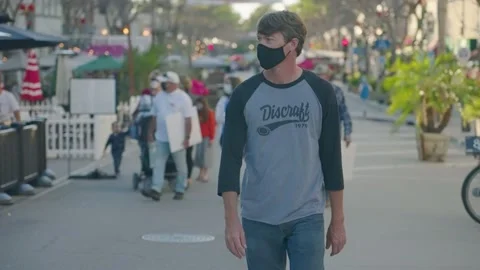 Man walks down Main Street during Coronavirus pandemic Stock Footage 143295079