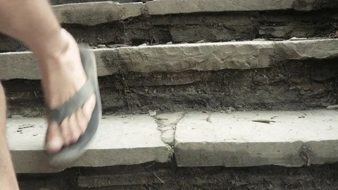 Man Walks Down Natural Stone Steps on a Hiking Path Stock Footage 81498212