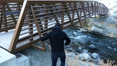 Man Walks Down To River Stock Footage 123452881