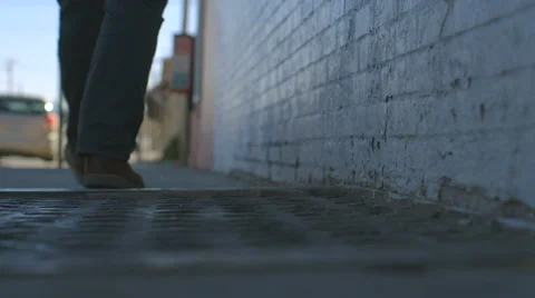 Man Walks Down Sidewalk Video stock 60129458