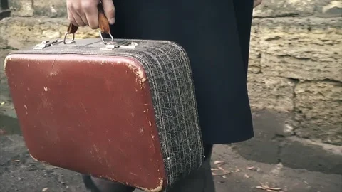 A Man Walks Down The Street With An Old Suitcase. Stock Footage 145181815