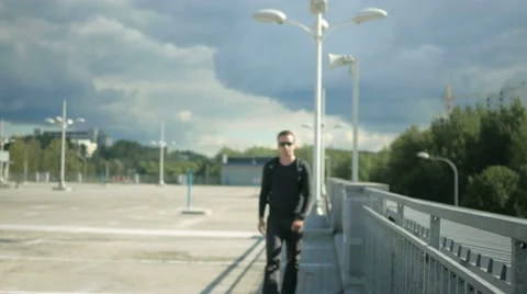 A man walks down the street stops because of the message on the smart watch. He Stock Footage 66578762