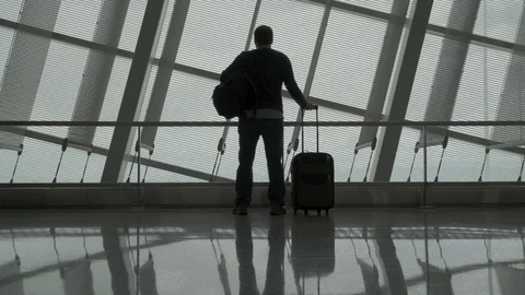 Man walks in an empty airport Stock Footage 129345673