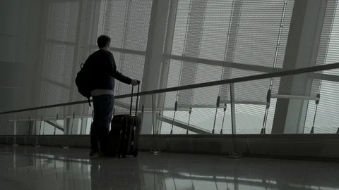Man walks in an empty airport Stock Footage 129345719