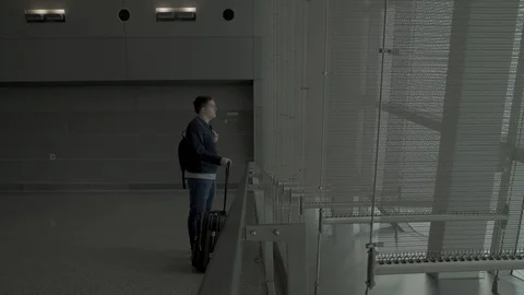 Man walks in an empty airport Stock Footage 129345730