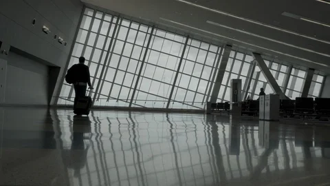 Man walks in an empty airport Stock Footage 129346037