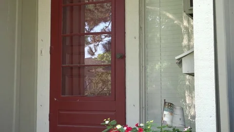 A Man Walks to Front Door, Grabs Mail and Unlocks Door Stock-Footage 79111057