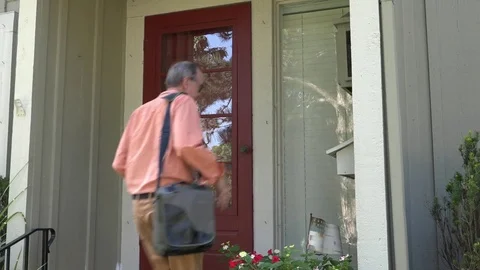 A Man Walks to Front Door, Grabs Mail and Unlocks Door Stock Footage 79111073