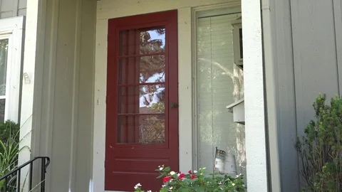 A Man Walks to Front Door, Grabs Mail and Unlocks Door Stock Footage 79111076