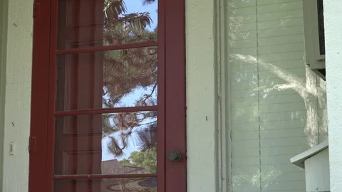A Man Walks to Front Door, Grabs Mail and Unlocks Door Stock Footage 79111080