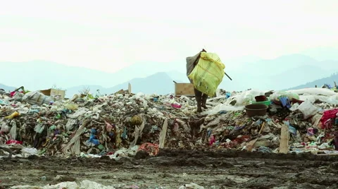 Man walks in Garbage Stock Footage 50637604