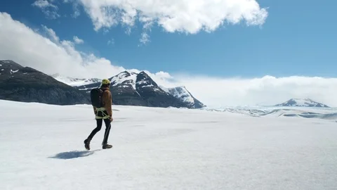 Man walks on a glacier Video stock 101716792