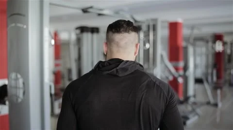 A man walks on the gym Stock Footage 56636630