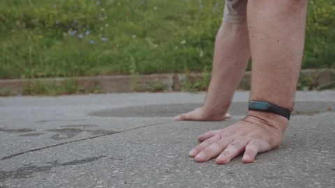 A man walks on his hands, a close-up of a man on his hands Stock Footage 247546799