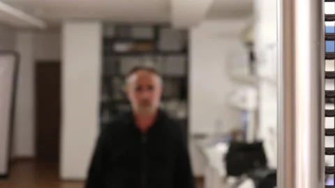 Man walks into his office Stock Footage 133115657