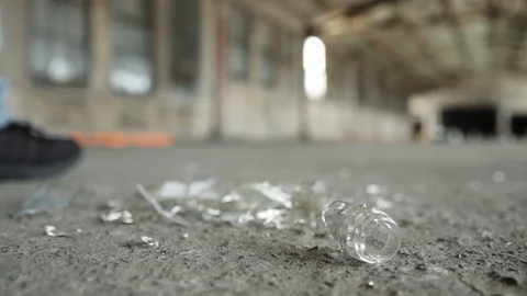 Man walks left away from broken glass Stock-Footage 88052112