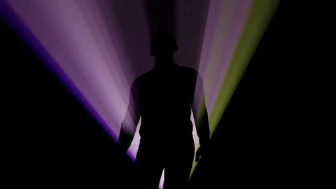 Man walks in light rays or beams 스톡 동영상 295048912