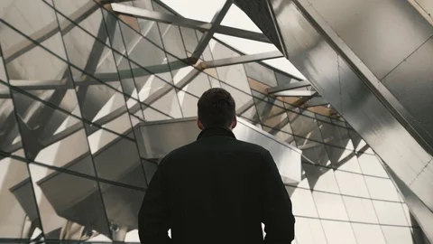 Man walks in a modern building Stock Footage 129466064