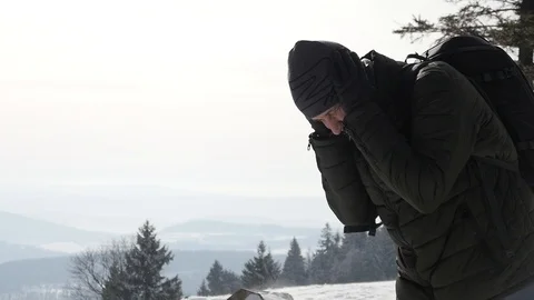 A Man walks in a Mountain against a Wind - Winter Snow Blizzard Stock Footage 102543067