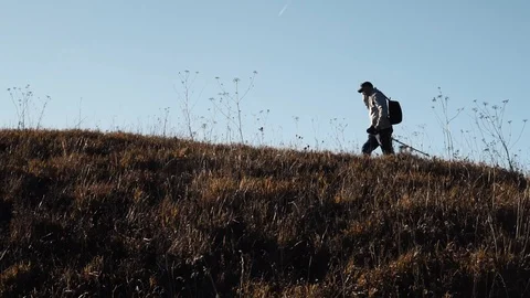 A man walks on a mountain Stock Footage 118211459