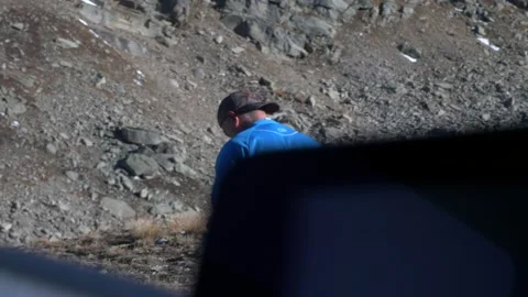 Man walks on a mountain path. View from car. 스톡 동영상 237743152