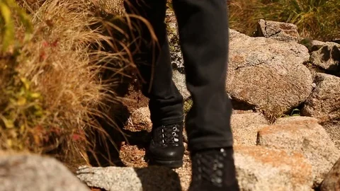 Man walks mountain trail away. Stock Footage 80947004