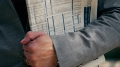 Man Walks With Newspaper Under Arm Stock Footage 236710293