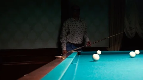 Man walks next to a pool table Stock Footage 95998326