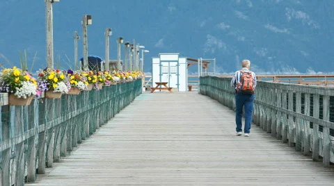Man walks out on pier dock P HD 0057 Stock Footage 824142