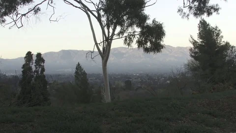 A man walks past mountains side view. Video stock 99605059