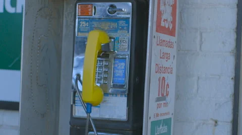 Man Walks by Pay Phone Stock Footage 60128819