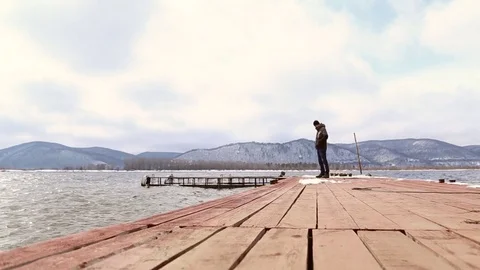 The man walks on the pier Stock Footage 74162224