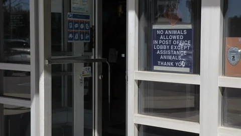 Man Walks Into Post Office Stock Footage 128538143