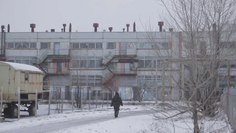 Man walks at Pripyat Stock Footage 70939377
