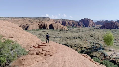 Man Walks On Rocks in Utah Stock Footage 130166544