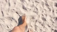 Man Walks On Sandy Beach, Top View On Feet Stock Footage