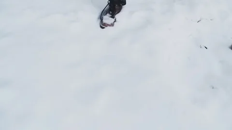 A man walks on a snow-covered path Stock Footage 76597501