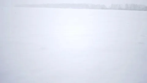 Man walks in the snow Stock Footage 72715654