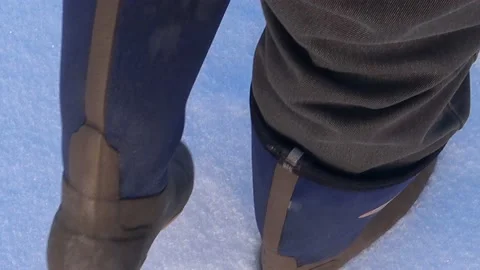A man walks in the snow Video stock 168156600
