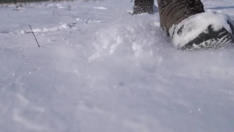 A man walks in the snow in winter. An active, tourist lifestyle. Video stock 333778094